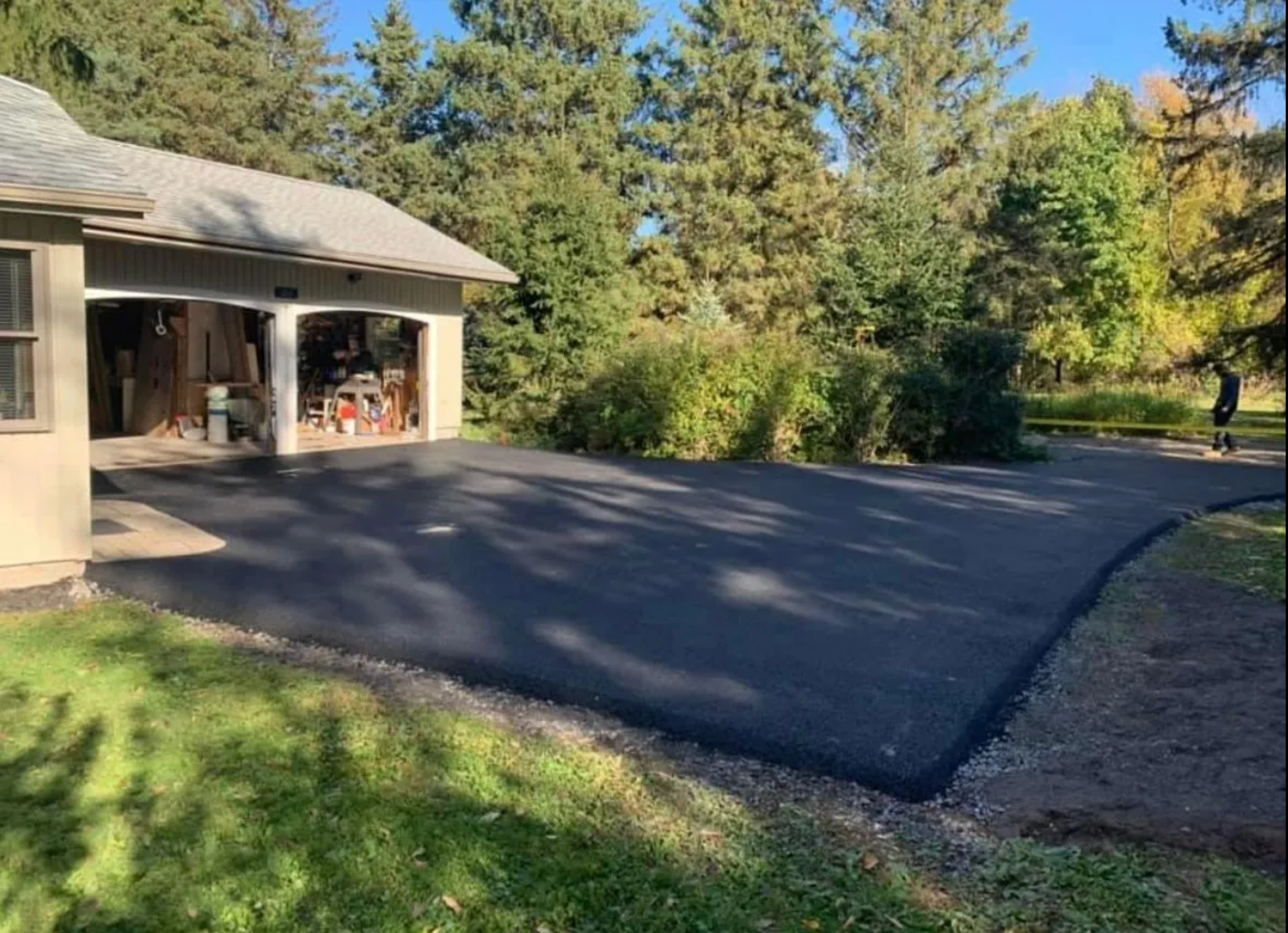 Residential asphalt driveway with garage Rochester NY