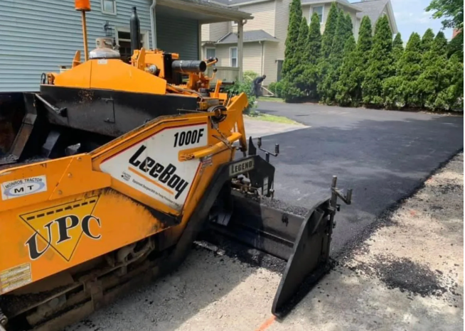 UPC LeeBoy paving machine laying fresh asphalt